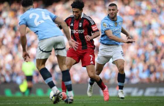 Raul Jimenez of Fulham (C) in action against Josko Gvardiol of Manchester City (L) and Mateo Kovacic of Manchester City (R)