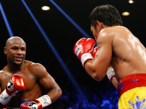 Netflix negocia la revancha histórica: Pacquiao vs. Mayweather II Pacquiao vs Mayweather en su combate de 2015. Foto de archivo.