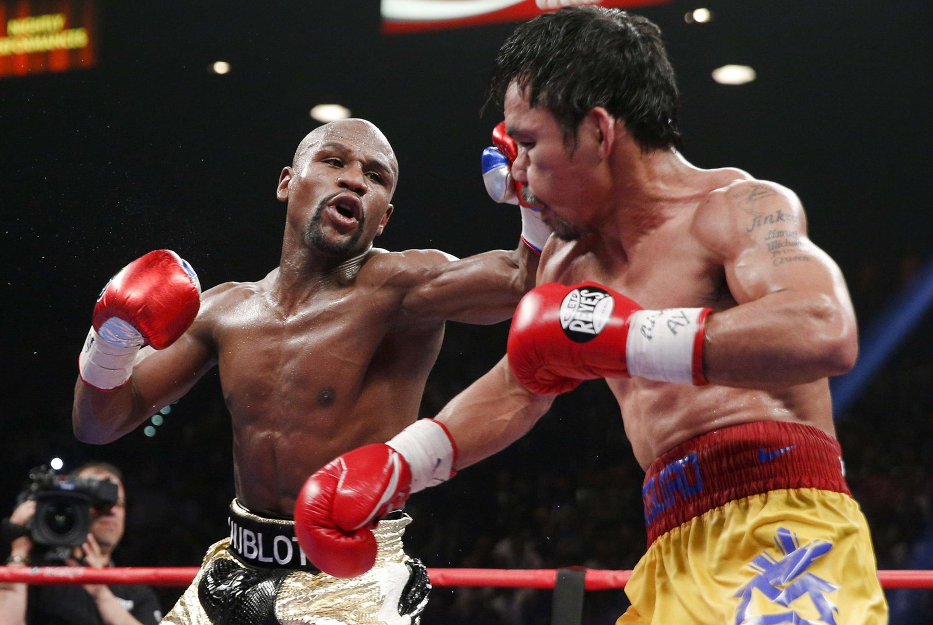 El estadounidense Floyd Mayweather Jr. (i) y el filipino Manny Pacquiao (d), en una imagen de archivo. EFE/Esther Lin