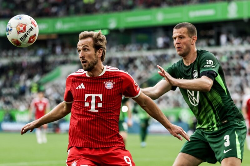 WOLFSBURG (Germany), 09/05/2026.- Harry Kane of Bayern Munich in action against Denis Vavro (R) of Wolfsburg during the German Bundesliga soccer match between VfL Wolfsburg and Bayern Munich in Wolfsburg , Germany, 09 May 2026. (Alemania) EFE/EPA/FILIP SINGER The DFL regulations prohibit any use of photographs as image sequences and/or quasi-video